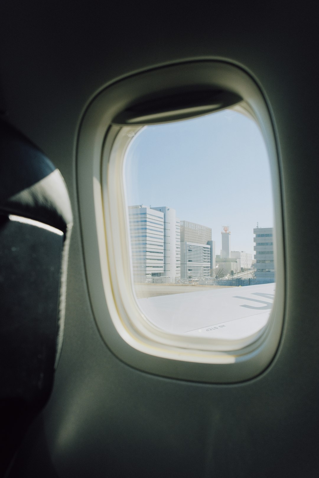 view-of-buildings-from-an-airplane-window-esrehwbtuoo